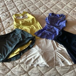 Collection of tennis skirts and tops. They all fit very nicely with sizes s/m